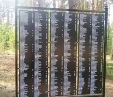 One of the memorial panels at the mass grave site